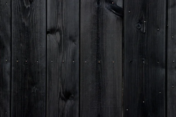 Parede de madeira pintada de preto antigo textura ou fundo — Fotografia de Stock