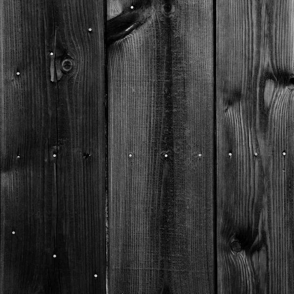 Vecchia parete di legno verniciato nero - texture o sfondo — Foto Stock