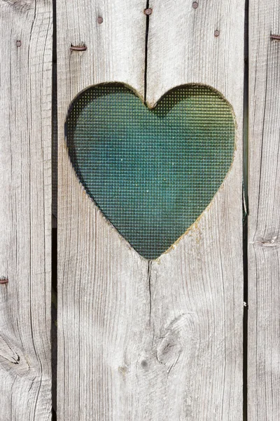 Die Holztür mit Herz. Hintergrund — Stockfoto