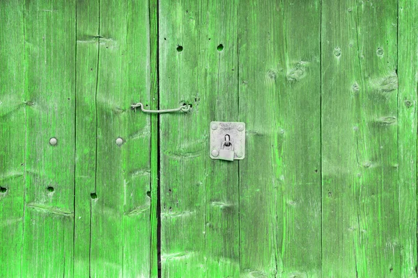 Doğal desenli eski yeşil ahşap doku.