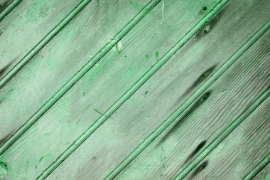 Doğal desenli eski yeşil ahşap doku.