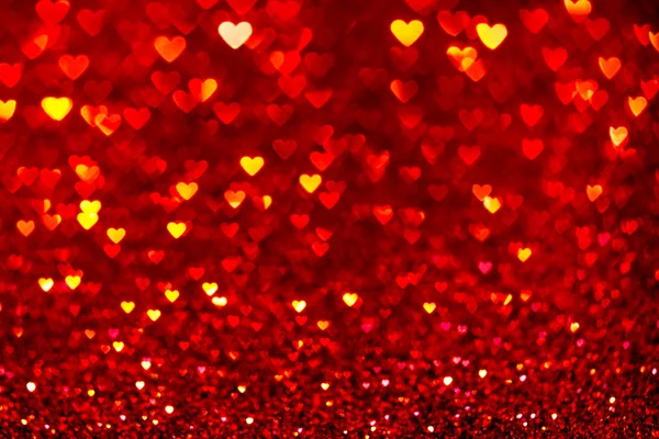 Rood hart bokeh achtergrond. De dag van Valentijnskaarten textuur. — Stockfoto