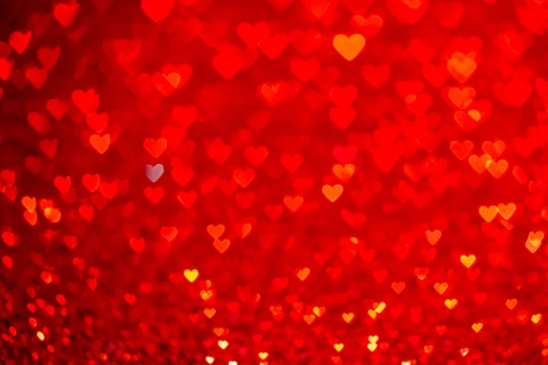 Rood hart bokeh achtergrond. De dag van Valentijnskaarten textuur. — Stockfoto