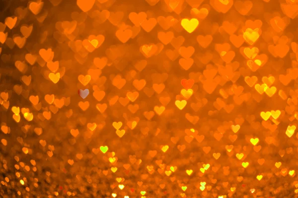 Orange heart bokeh background. Valentines day texture. — Stock Photo, Image