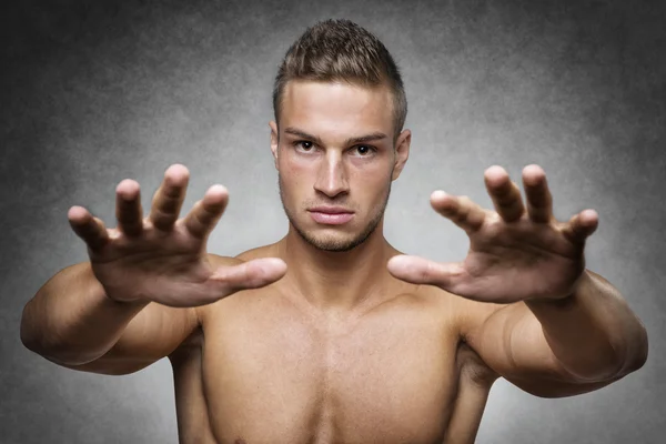 Athlete holds up his hands — Stock Photo, Image