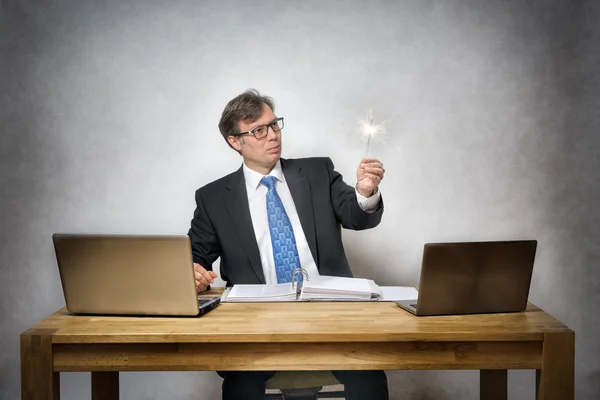 Business man with sparkler — Stock Photo, Image