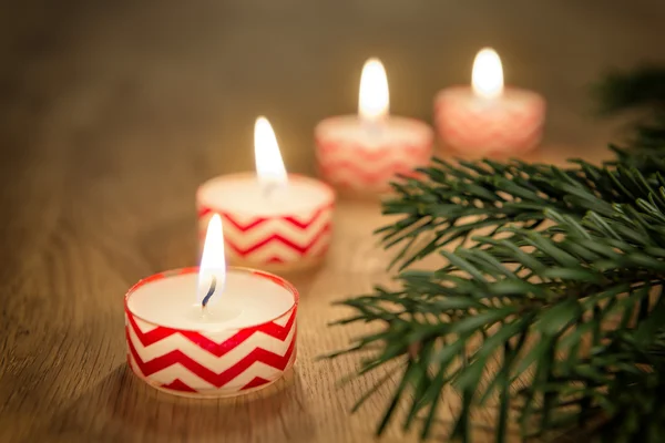 Romantic candles on wooden table — Stock Photo, Image