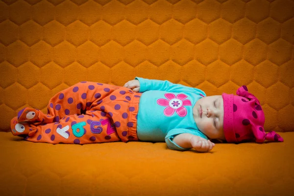 Baby girl sleeping on a couch — Stock Photo, Image