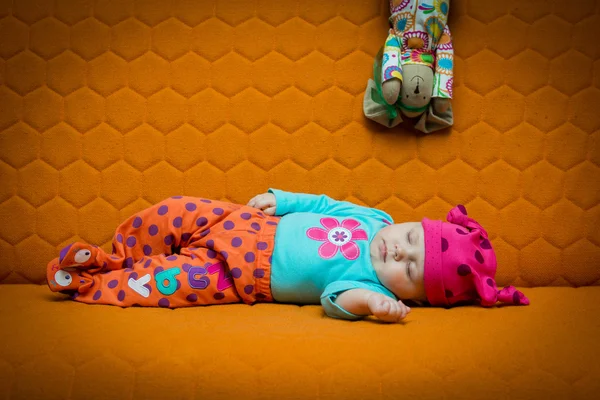 Baby girl sleeping on a couch — Stock Photo, Image