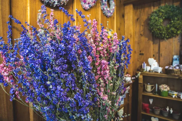 Spring bouquet of dried flowers of purple and pink flowers in the store decorations and colors.