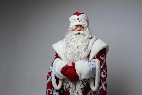 Calm Santa with hands together looking at camera. — Stock Photo, Image