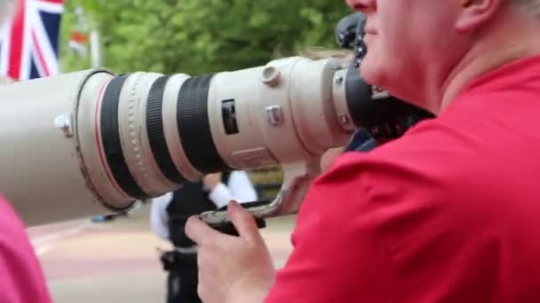 Paparazzi camera lens in action — Stock Video