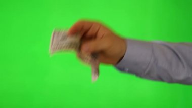 Dolar veren bir hareketle tutan el