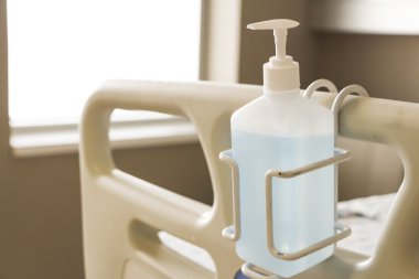 Hygiene gel dispenser in a hospital room clipart