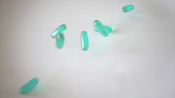 Liquid pills fall in super slow motion — Stock Video