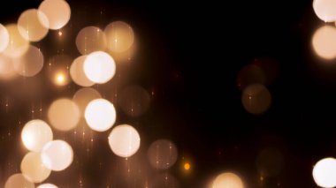 Siyah zemin üzerinde güzel bir şenlik bokeh altın halkalar, hafif gece bokeh etkisi, sönük. Kartpostal, gece görüşü..