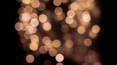 Siyah zemin üzerinde güzel bir şenlik bokeh altın halkalar, hafif gece bokeh etkisi, sönük. Kartpostal, gece görüşü..
