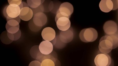 Siyah zemin üzerinde güzel bir şenlik bokeh altın halkalar, hafif gece bokeh etkisi, sönük. Kartpostal, gece görüşü..