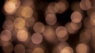 Siyah zemin üzerinde güzel bir şenlik bokeh altın halkalar, hafif gece bokeh etkisi, sönük. Kartpostal, gece görüşü..
