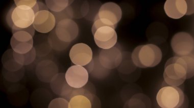 Siyah zemin üzerinde güzel bir şenlik bokeh altın halkalar, hafif gece bokeh etkisi, sönük. Kartpostal, gece görüşü..