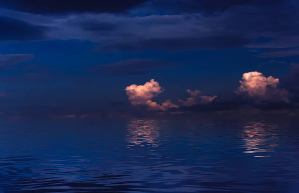 Night sky, horizon at sunset, moonlight, clouds, waves reflected in water. Empty sea landscape, natural scene. Night view.