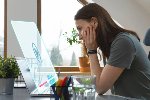 Women watching a video on a laptop at home office. New normal office working concept.