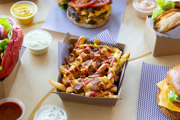 Take Out Burger Restaurant Table Setting Poutine Cheese Bacon Loaded — Stock Photo, Image