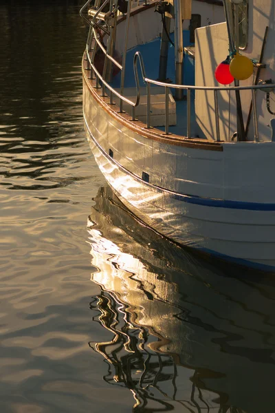 Warm light over the fishing harbour at Grisslehamn during late — Stock Photo, Image