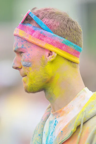 Man with colorful face at Color Run Tropicolor world tour in Sto — Stock Photo, Image