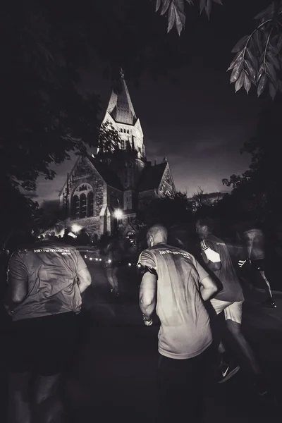 Runners at the Midnight run in Stockholm (Midnattsloppet) — Fotografie, imagine de stoc