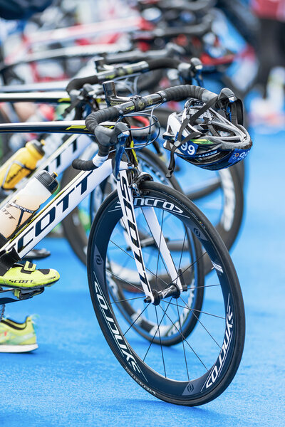 Front wheels of triathlon bikes with all other equipment at the 