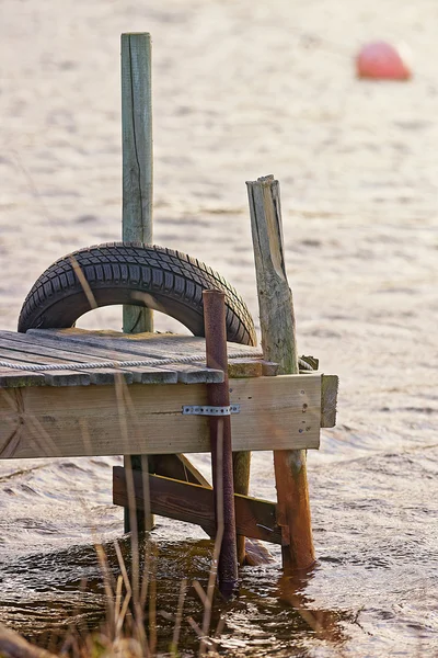 Old small jetty during afternoon sun — Stock Photo, Image