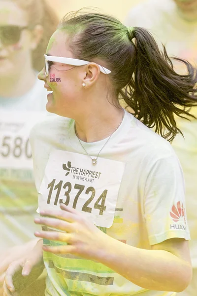 Happy girl running at Stockholm Color Run