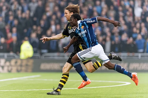 Two players chasing the ball in the soccer game DIF vs AIK at Te — Stock Photo, Image