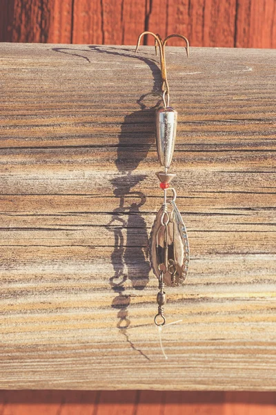 Old fishing lure in evening light — Stock Photo, Image