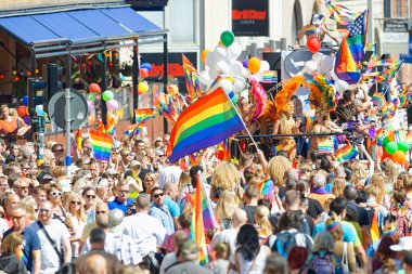 The parade and the spectators at the Pride parade