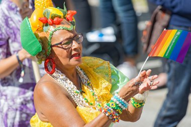 Colorful older woman at the Pride parade