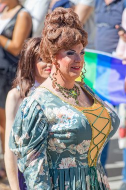 Vintage crossdresser with a big wig at the Pride parade clipart