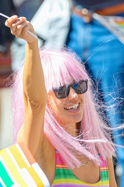 Girl with long pink hair and black glasses at the Pride parade — Stock Photo, Image