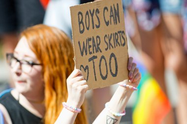 Sign saying Boys can wear skirts too at the Pride parade