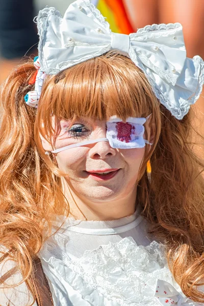 Cosplay nurse in blood with one eye at the Pride parade — Stock Photo, Image