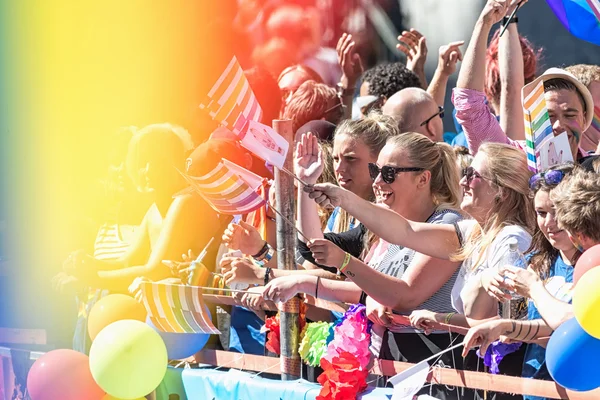 Happy participants waving to the crowd at the Pride parade — Stok fotoğraf