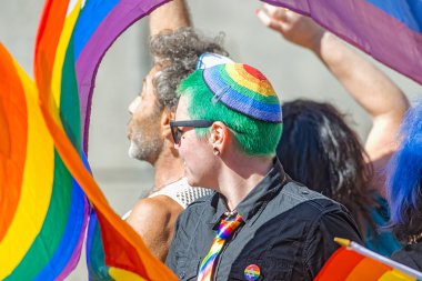 Jewish floater with a man with a colorful kippah at the Pride pa