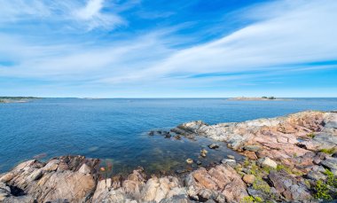 Rocky coastline in vivid colors during a beautiful summer day
