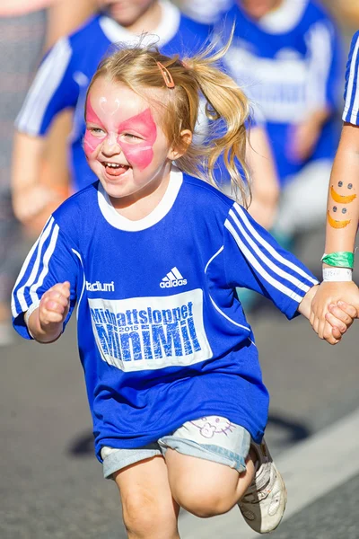 Very happy little girl with face painting at the Minimil for the — Stock Photo, Image