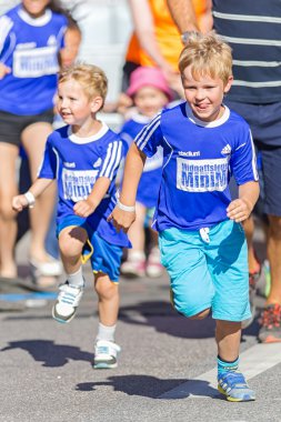 Two boys in a flying start at the Minimil for the youngest runne
