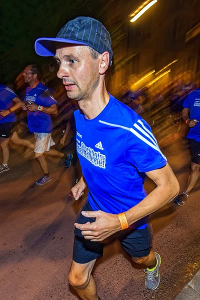 Closeup of male runner at Midnattsloppet or the Midnight run — Stok fotoğraf