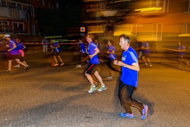 Sideview of a older runner with motion blur on the streets of So