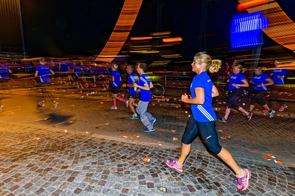 Sideview of a woman runner with motion blur on the streets of So — Stok fotoğraf