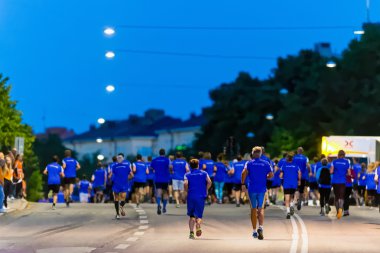 Back of runners after the start at Midnattsloppet or the Midnigh